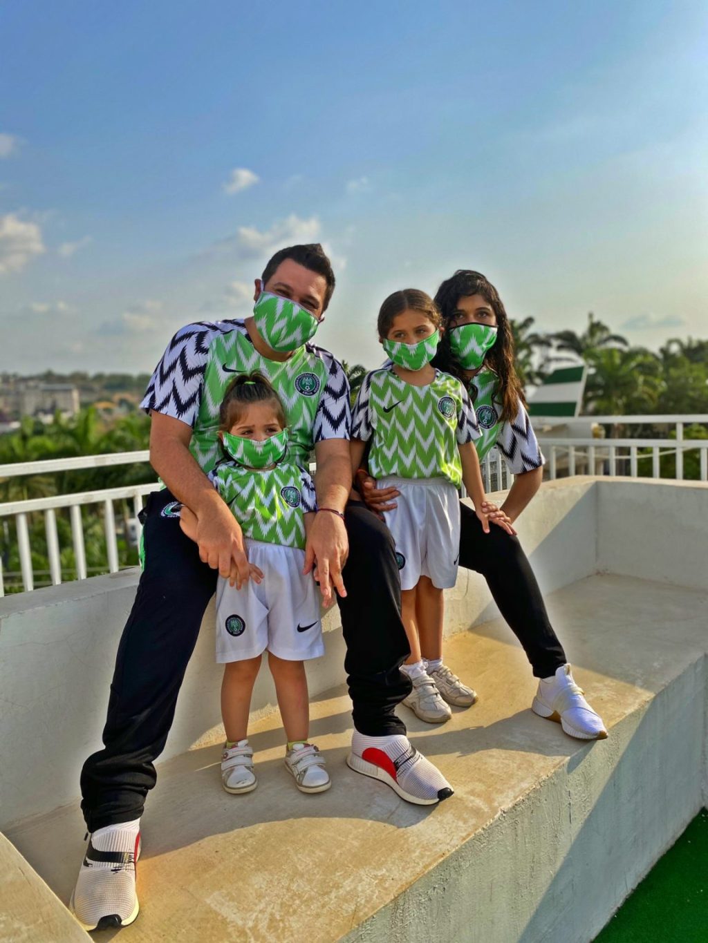 Family photo with Nigeria's jersey and face masks
