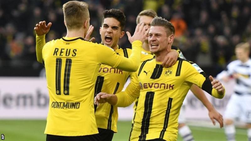 Borussia Dortmund top group with a draw in Madrid