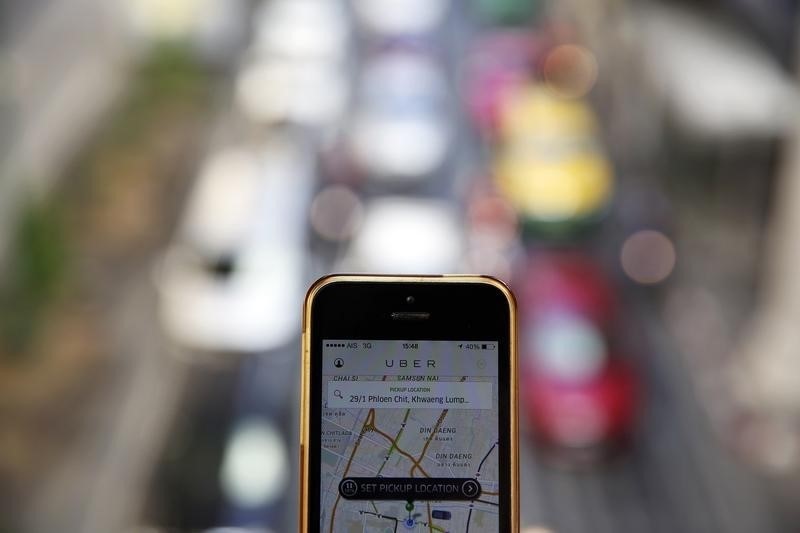 Uber resumes service with new rules, appeals huge fine