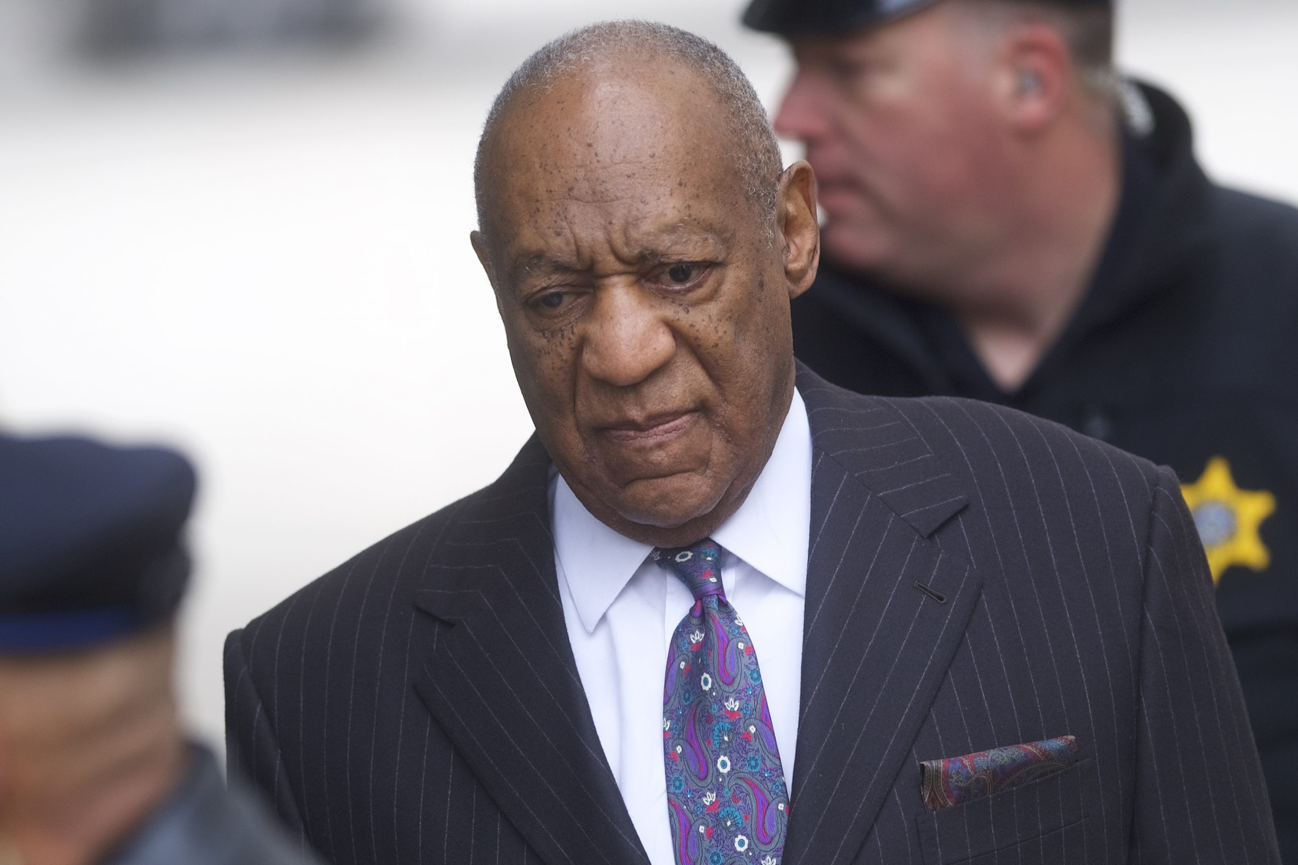 A female protester goes nude, rushes Bill Cosby at sexual assault trial
