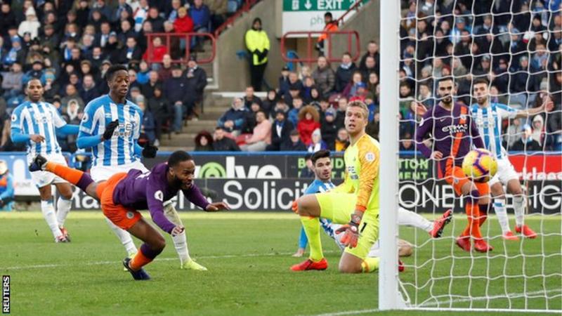 Man City hit 100 league goals over managerless Huddersfield