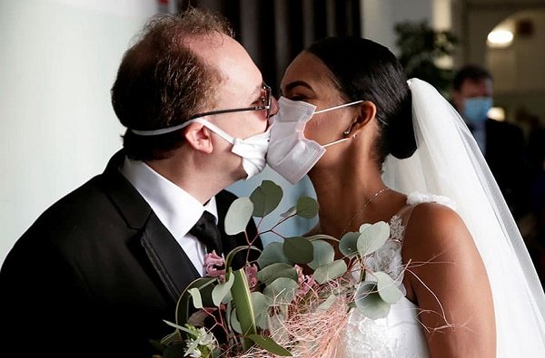 Couple wed in coronavirus face masks at ceremony with no guests in Italy