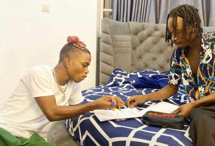 Photo: Naira Marley signs Olamide’s former artiste, Lyta