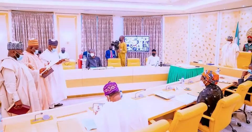 Buhari swears in three INEC commissioners