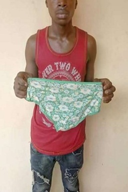 Suspected yahoo boy caught on camera stealing panties from a building
