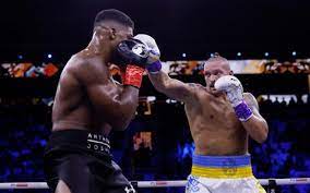 Oleksandr Usyk defeats Anthony Joshua to retain IBF, WBA and WBO heavyweight title 