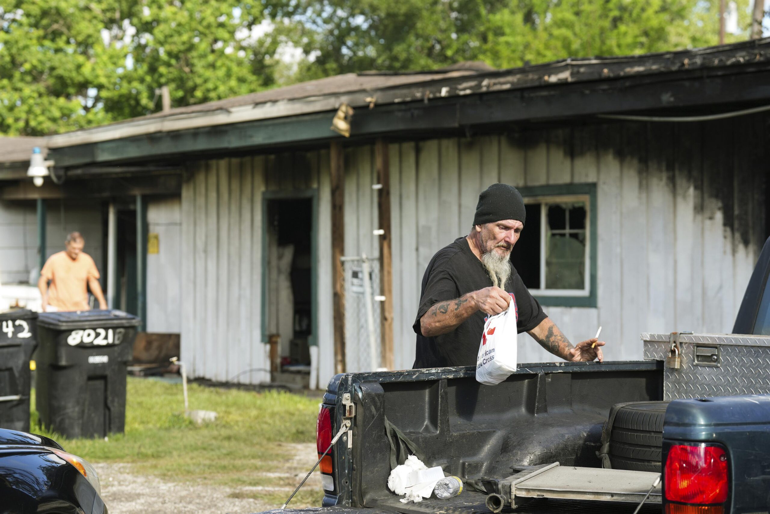 Gunman kills 3 tenants, set fire to lure them