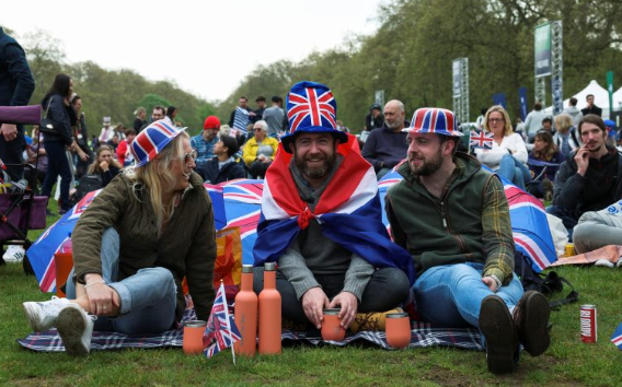 King Charles’ coronation draws thousands in paper crowns and plastic tiaras