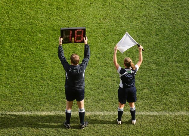What is the role of fourth officials in football?