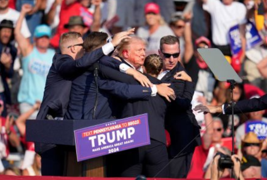 Photos of Trump covered In blood after suspected assassination attempt