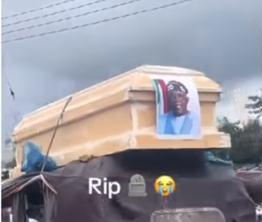 He did It to Goodluck – Reactions as Nigerians protest with mock coffin of Tinubu