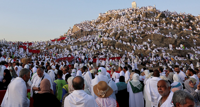 Muslim pilgrims pray at Mount Arafat in Hajj